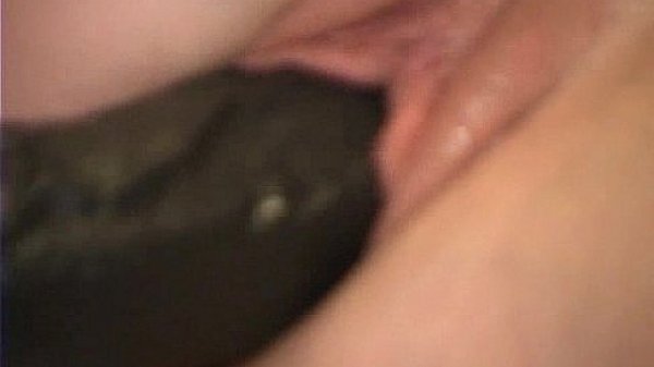Redhead riding a b. dildo and cumming from the size