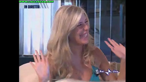 Live television panty oops upskirt as a hottie picks up a dog and leaves her underwear on display