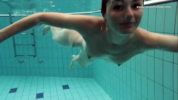 Russian girl swims nude while stripping in the pool  