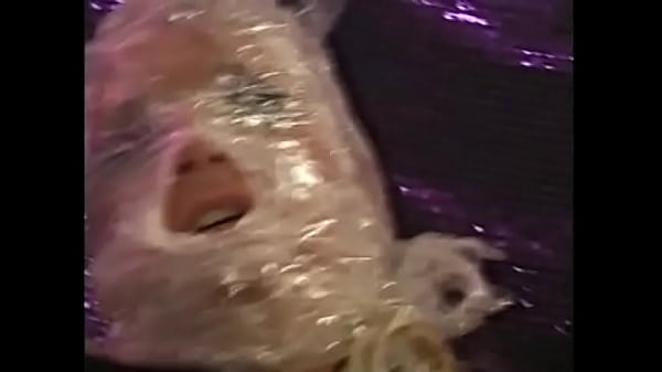 Muscular dude in a black mask fucks a naughty chick wrapped in tape  