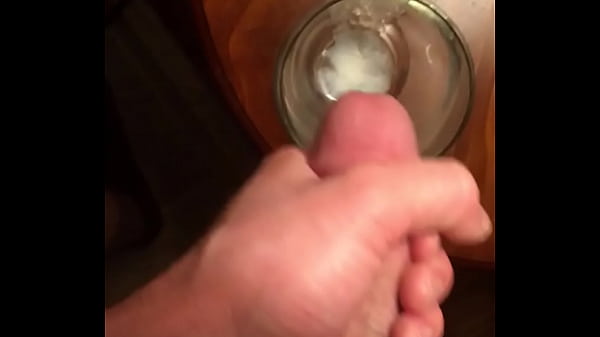 Close up cumshot in glass