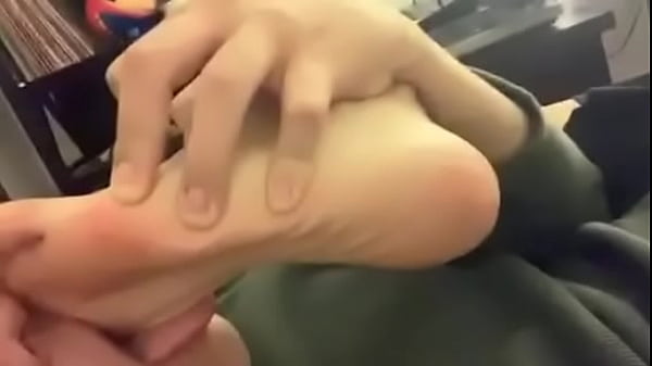 Sexy guy licking his soft sweaty feet