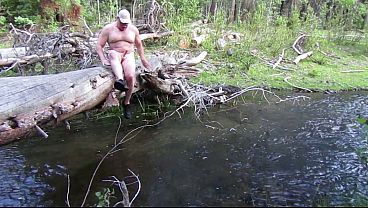 Naked in nature and skinny dipping. 