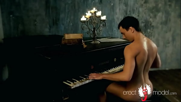 Hot young man with erect dick and nice butt strips naked playing the piano