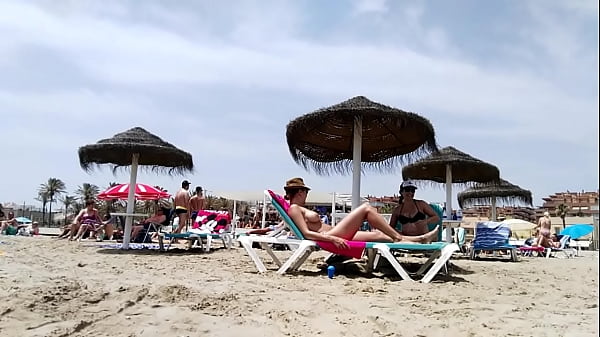 Brunette with huge tits on the beach - part 2