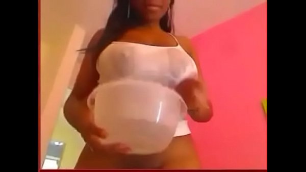 black girl teases with huge boobs in white top