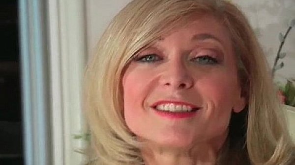 Blond MILF Nina stripping and rubbing