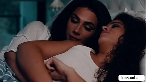 TS stepmom and her curly haired stepdaughter are on the bed kissing each other.After that,she licks and fucks her stepdaughters pussy. 