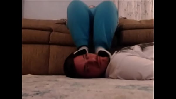 feet kicking the slave's face in cute socks to some music