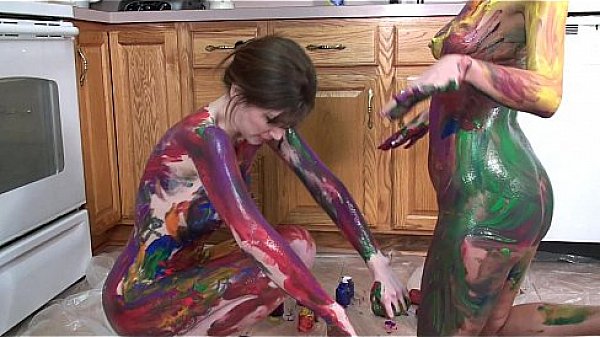 Lavender Rayne and Indigo Augustine playing with paint