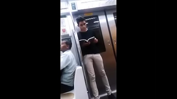 Horny young guy reading a book