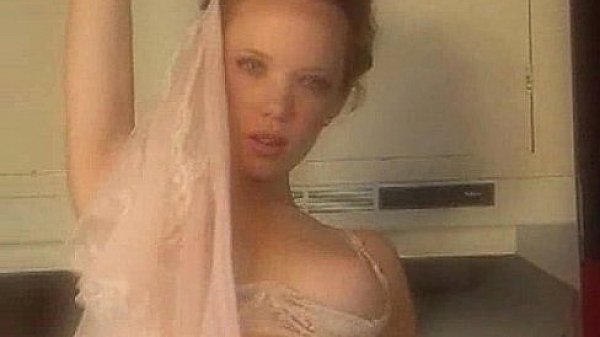 Heather Carolin stripping in the kitchen 