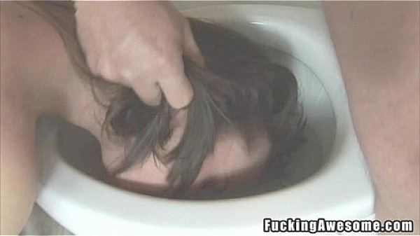 Pretty brunette sucks in the toilet