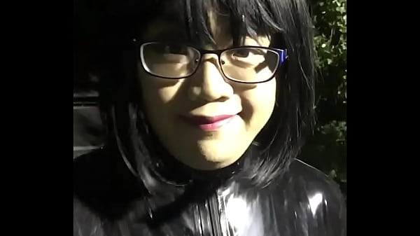 latex crossdresser walking toy at public