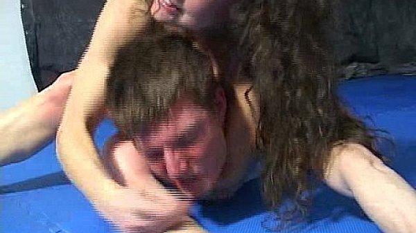 Mistress in bikini defeats man by scissorhold in a fight