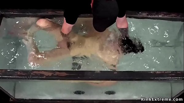 Brunette slut Juliette March in rope suspension takes water bondage then master sinks her in aquarium with tied up hands 