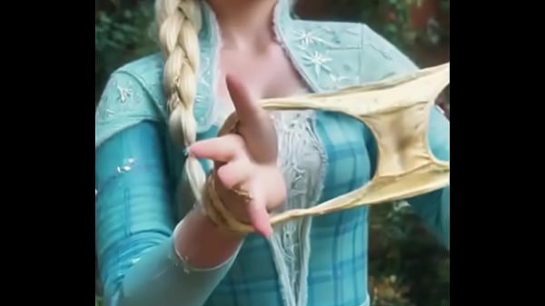 She's unraveling the chill with a playful tug, where braids meet bold invitations.No frozen fortress&mdash;this Elsa beckons from the edge of enchanted edges.  