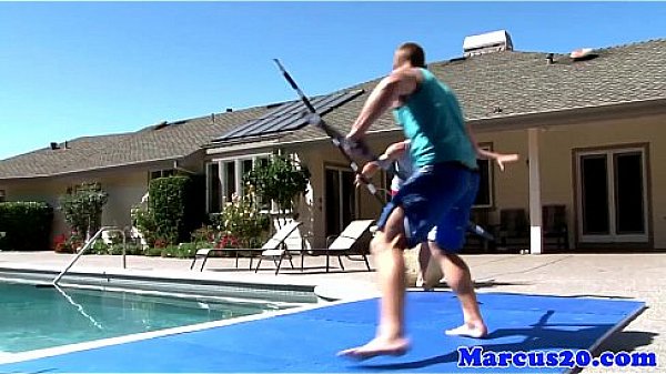 Gay muscular jocks fighting by the pool