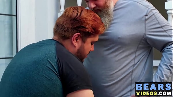 Little cub blows a hairy bear outdoors 