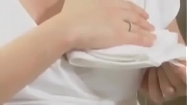 She spreads her milk into a glass and drinks