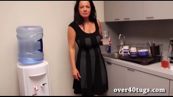 Busty mature strokes cock in the kitchen