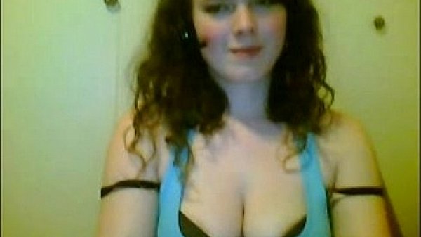 Busty teen brunette reveals her tits