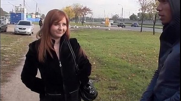 Busty redhead blowjob in a park
