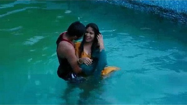 Lovers hot romance in swimming pool