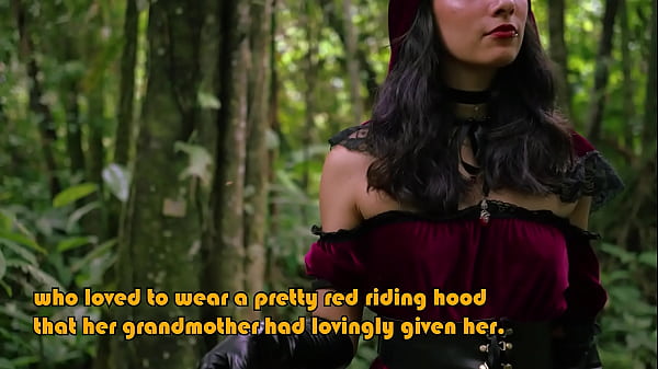 Little Red Riding Hood walking alone in the forest