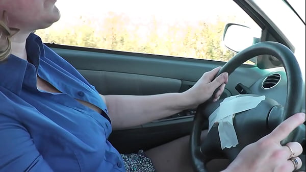 Sexy blonde MILF Frina drives car in stockings without panties under skirt. Naked in public. No panties