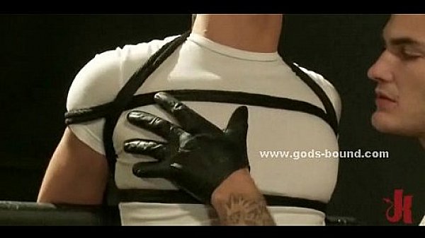 Strong man bound in rope and immobilized