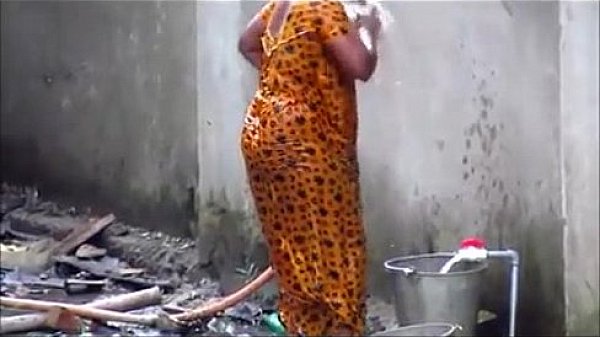 indian couple bathing out side
