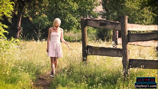 Small tits Hungarian MILF model Mikki Galante gets naked out in a field with a  