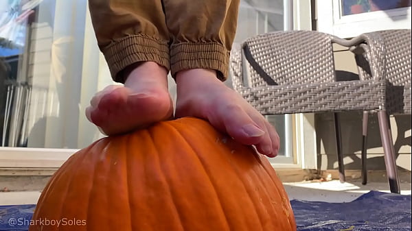 Crushing pumpkin with big boy feet 