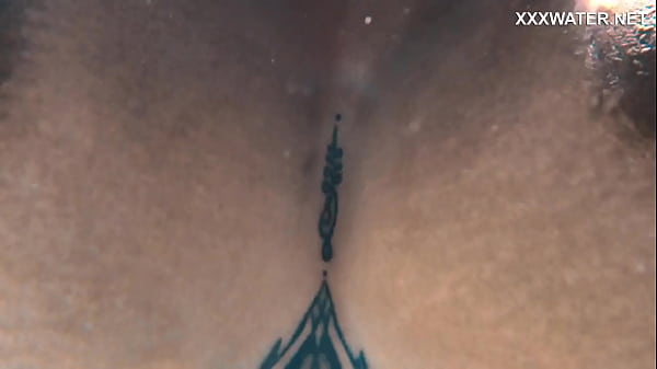 Yorgelis Carrillo, a famous pornstar, glides nude through the water