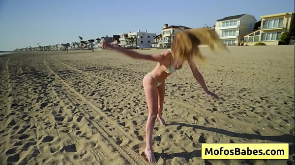 Watch naughty blondie girl getting naughty at the beach and messing with her pink pussy  