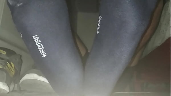 gray sneakers and sweaty foot in my room with jerk  