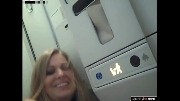 Kinky couple have sex in a plane