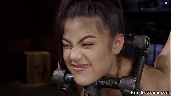 Hot petite brunette slave Kendra Spade standing on pins surface while her head and hands are in wooden boxes suffering pain then master toying her in dungeon