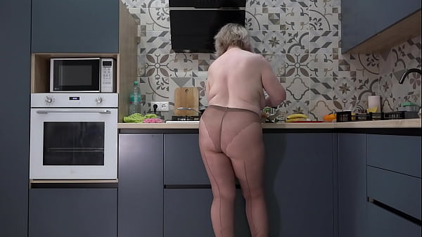 What do you want for breakfast: me or scrambled eggs? Curvy wife in nylon pantyhose in the kitchen. Busty milf with big ass behind the scenes.  