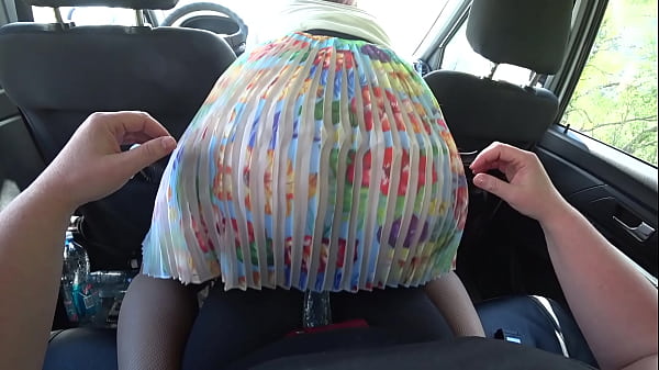 A girlfriend in the car fucked a lesbian with juicy booty under her skirt.  