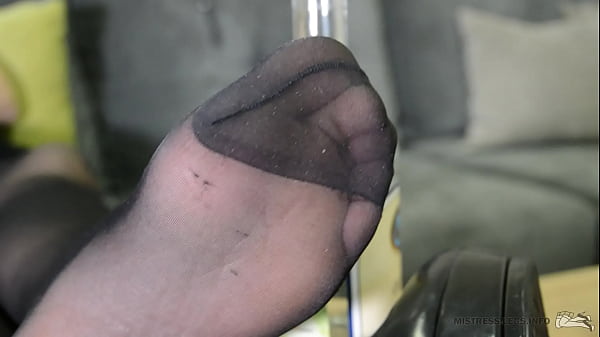 Mistress with sexy feet in black nylons with reinforced toes