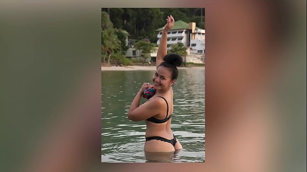 Babe Models a Thong at the Beach