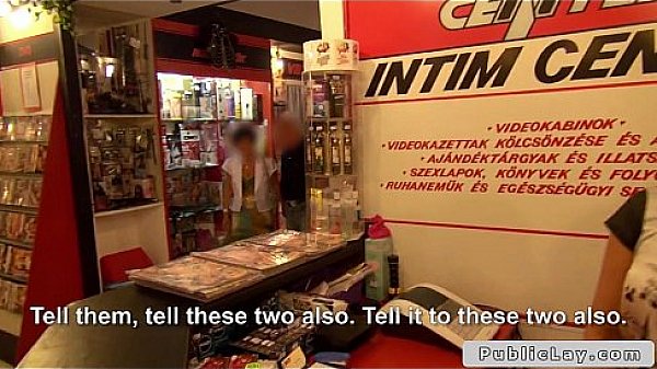 Dude bangs babe in porn store behind front desk