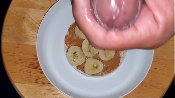 Snack covered in bananas and sperm cream.