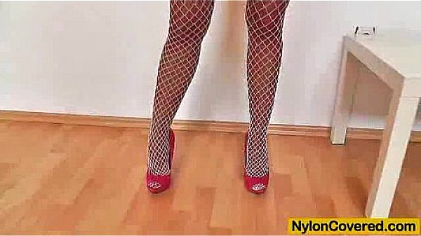 Stunning skinny beauty wears sky-high heels and nylons pantyhose on her nice lon