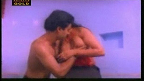 Indian aunty doing oil massage to her husband