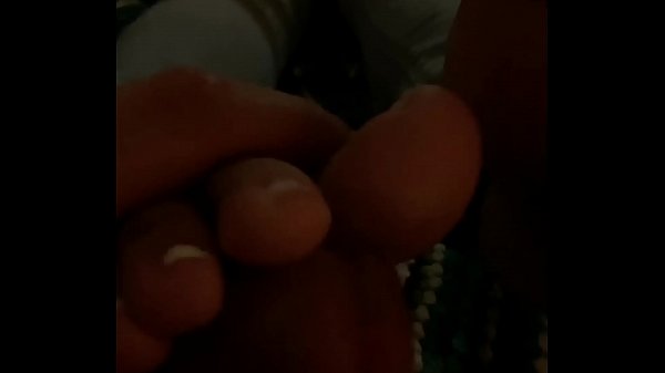 Footjob while she&rsquo;s on her phone  