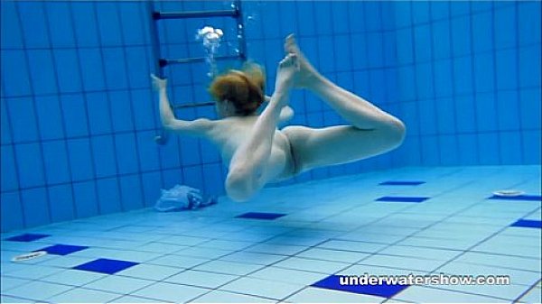 Cute Lucie is stripping underwater