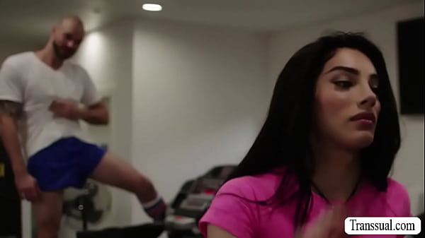 Bald guy cant stop starring at the ass of busty shemale while working out.After that,he licks her ass and barebacks it. 